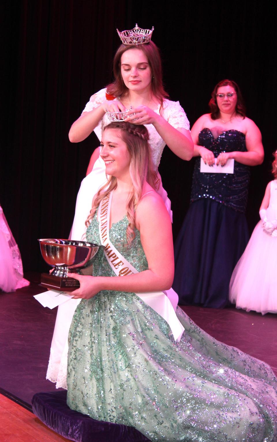 Gracie Paulman, 17, of Meyersdale was crowned Queen Maple LXXVII by last year's Queen Maple LXXVI Laura Boyce during the scholarship pageant at Meyersdale Area High School on Saturday evening.