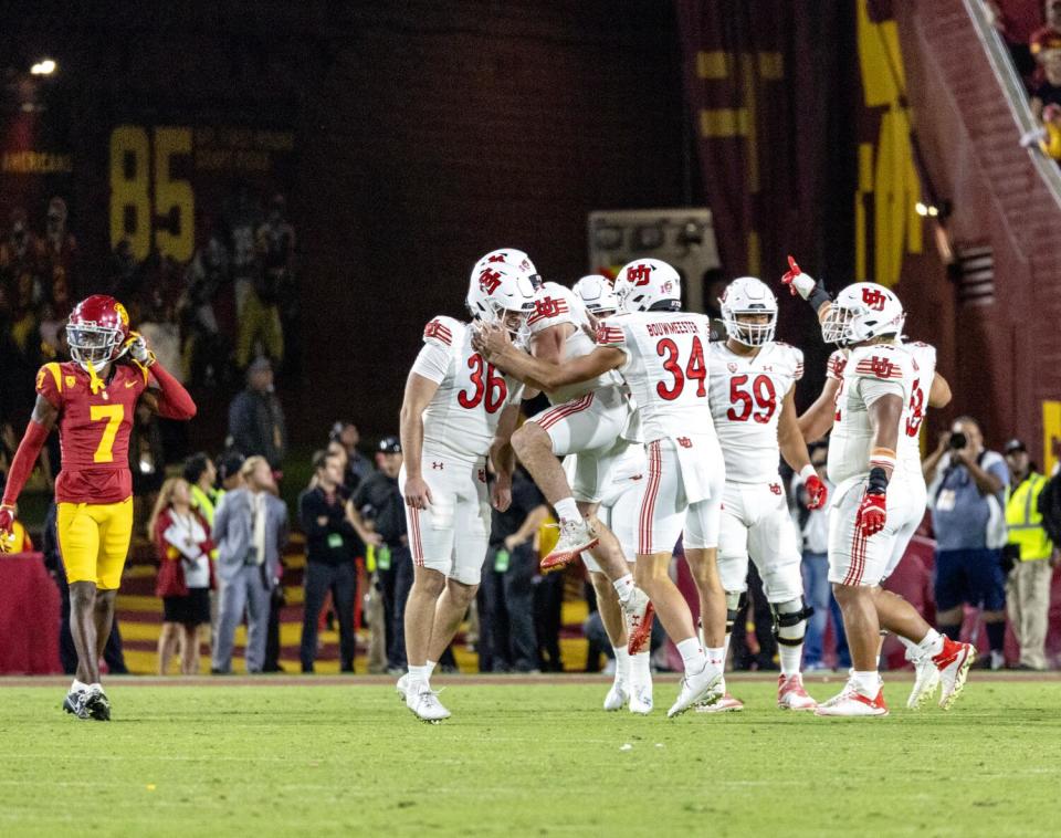 Cole Becker celebrates with Utah teammates.