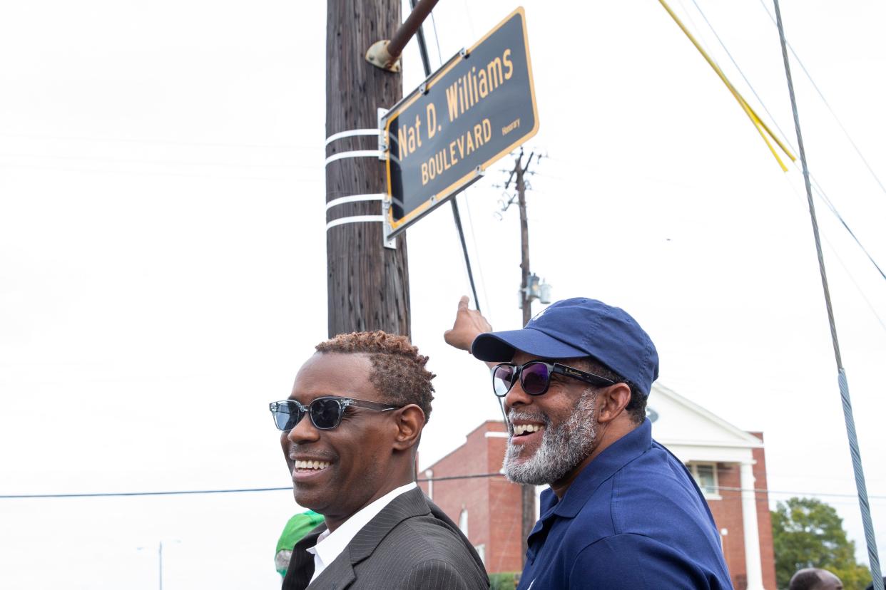 Nathaniel Jones, grandson of Nat D. Williams, and Steve Turner, Williams’ great grandson, pose for a photo pointing to the sign during the Nat D. Williams street naming ceremony outside Booker T. Washington High School in Memphis, Tenn., on Friday, October 27, 2023. Williams, who was hailed as the first Black radio personality in Memphis and “The Voice of Beale Street,” was a history teacher at the school for 43 years. “It’s really a honor,” Turner said. “It goes to show that good work comes out of good things when people do the right thing. He was a great educator and a great grandfather. Miss him very much.”