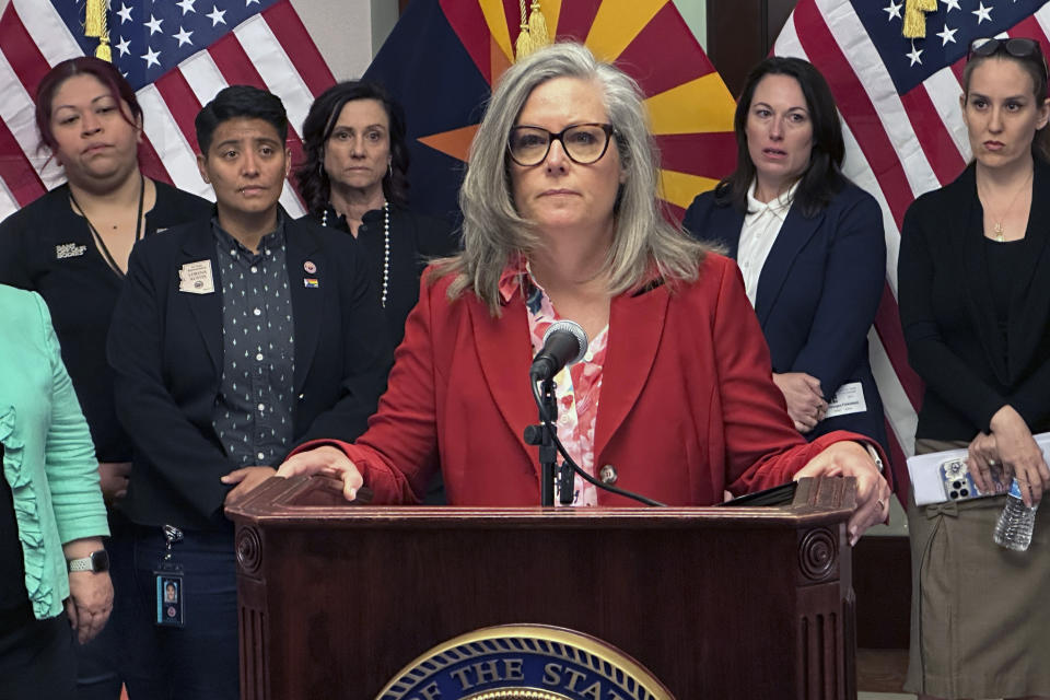 Arizona Gov. Katie Hobbs speaks to reporters at the state Capitol in Phoenix on Tuesday, April 9, 2024. (AP Photo/Jonathan Copper)