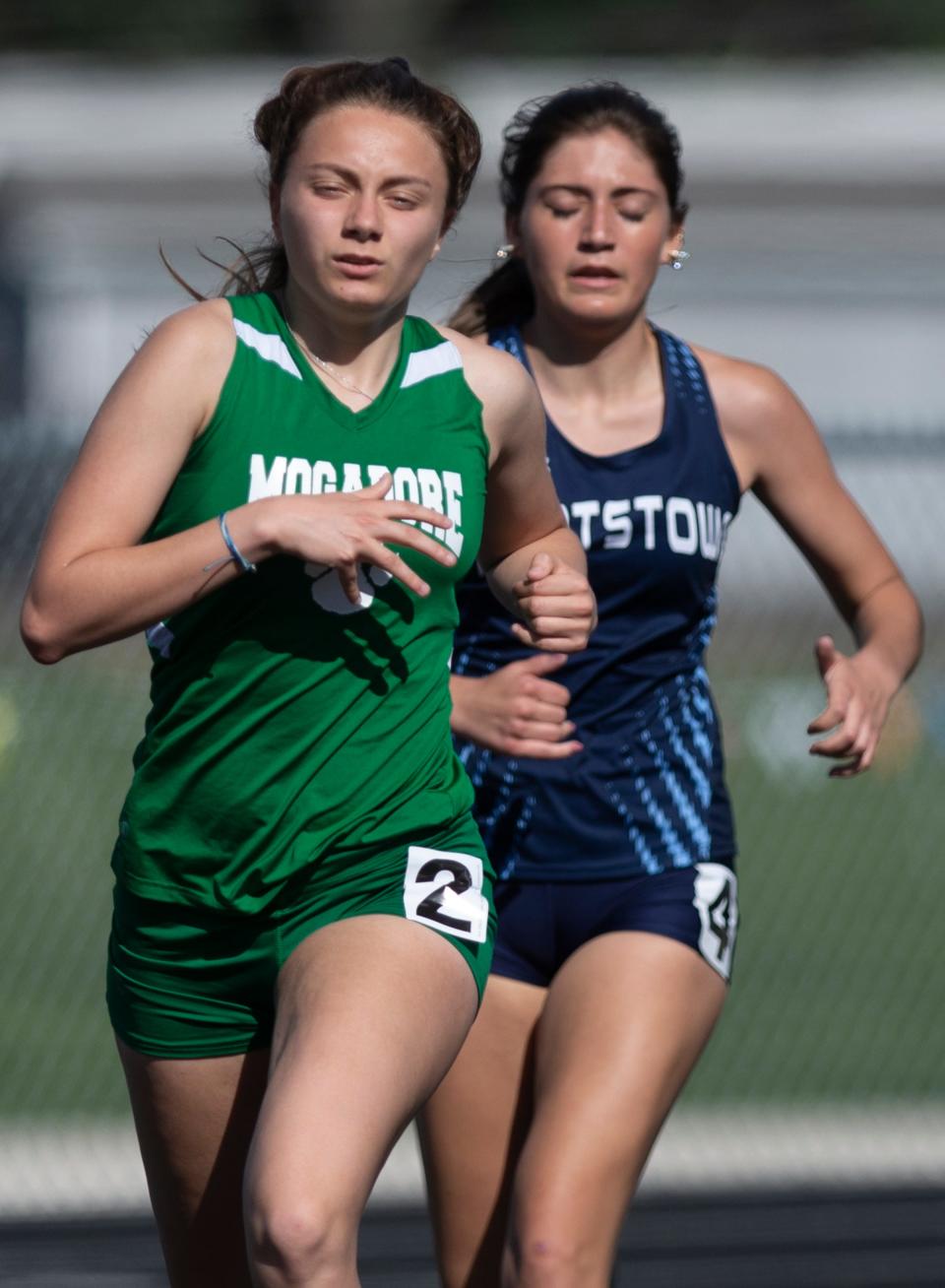 Mogadore's Rachel Whetstone, left, runs alongside Rootstown's Sydney Munger in the 1600 at Friday's Portage Trail Conference Championships.