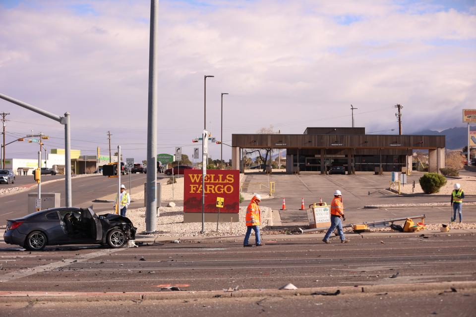 Workers clear the scene of a fatal crash Friday morning in West El Paso. The wreck occurred in the area near Mesa Street and Pitt Street. A man from Mexico died in the crash. Mikel Steve Fernandez, 18, of El Paso, was arrested on suspicion of human smuggling and evading arrest in a motor vehicle causing serious bodily injury or death.