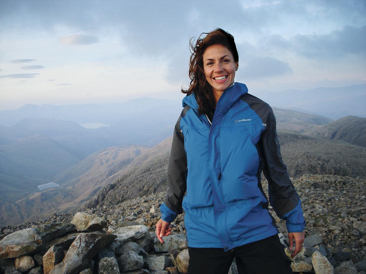 Julia Bradbury stands on mountain summit