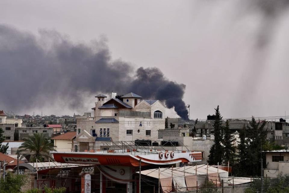 Black smoke rises over different parts of the region following the Israeli attacks in Rafah, Gaza on May 27, 2024