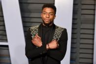 <p>Chadwick Boseman was everywhere in 2018, thanks to his leading role in <em>Black Panther. </em>Here, he embodies his character with the "Wakanda Forever" hand gesture on the red carpet. Sadly, Boseman passed away in 2020 after a secret battle with colon cancer.</p>