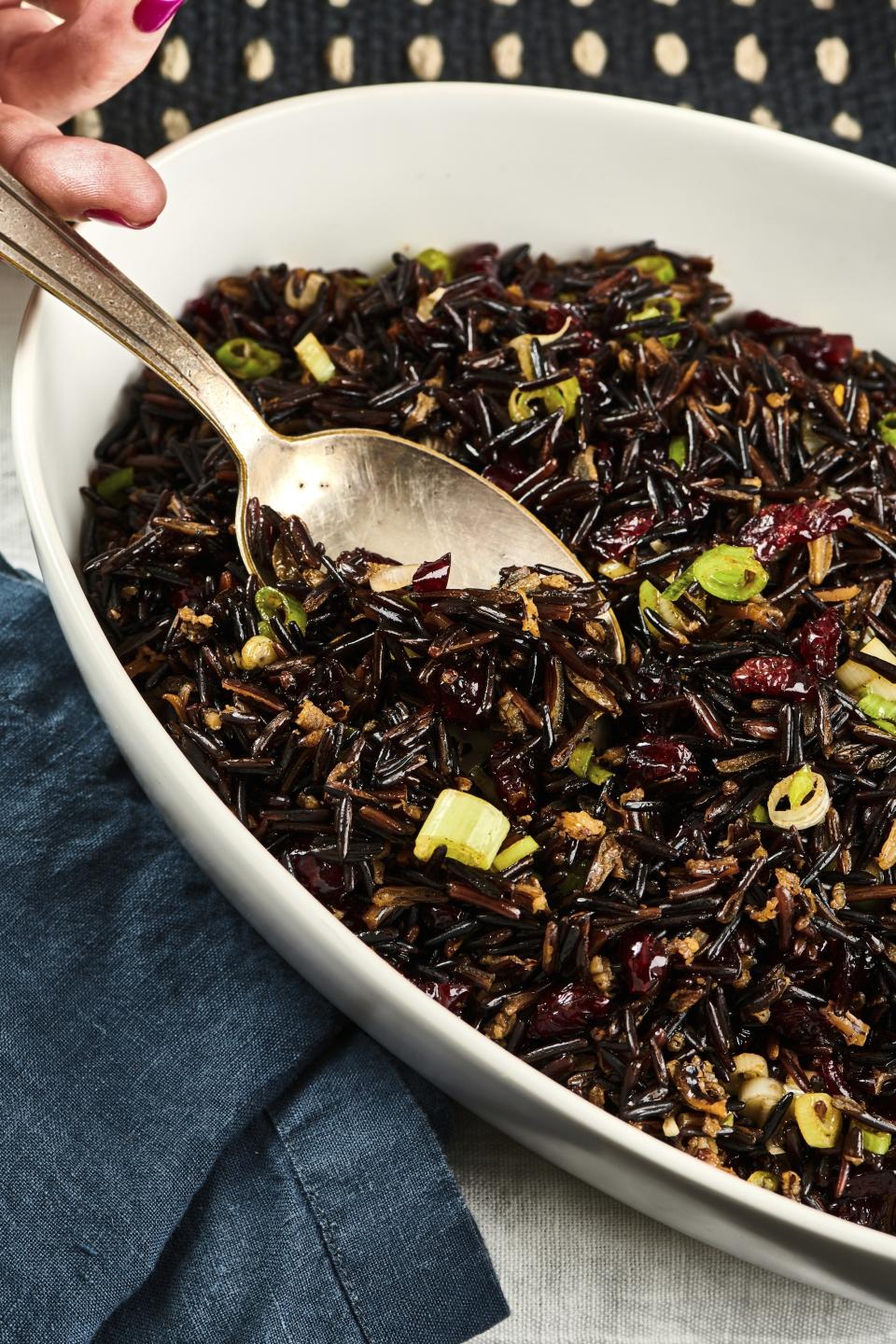 This image provided by Cheyenne Cohen shows wild rice salad with cranberries. Many a Thanksgiving gathering these days will include meat eaters, vegetarians and vegans around the same table. AP food writer Katie Workman has practice creating one feast that can please all of them without a lot of extra work. (Cheyenne Cohen via AP)