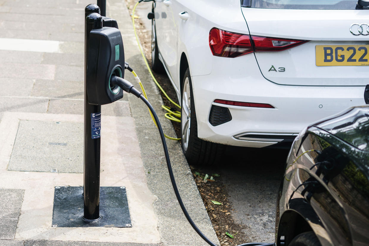 WEST SUSSEX, UNITED KINGDOM - 2023/06/27: Cars are being charged at an electric charging point in Worthing. United Kingdom aims at banning sale of new petrol and diesel cars by 2030. (Photo by James Wakibia/SOPA Images/LightRocket via Getty Images)