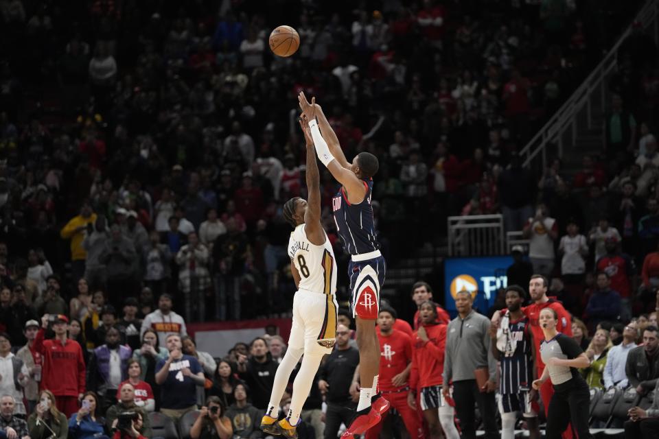 Houston Rockets' Jabari Smith Jr. (1) shoots the game-winning shot as New Orleans Pelicans' Naji Marshall (8) defends during the second half of an NBA basketball game Friday, March 17, 2023, in Houston. The Rockets won 114-112. (AP Photo/David J. Phillip)