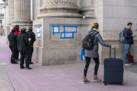 Blue tape and plastic covers swastikas drawn by vandals on the front of Union Station near the Capitol in Washington, Friday, Jan. 28, 2022. (AP Photo/J. Scott Applewhite)