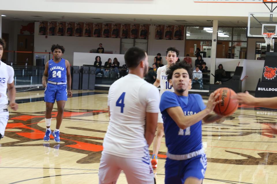 Carlsbad's Ismael Chavez drives to the basket during the opening day of the City of Champions Classic in Artesia on Dec. 1, 2022.