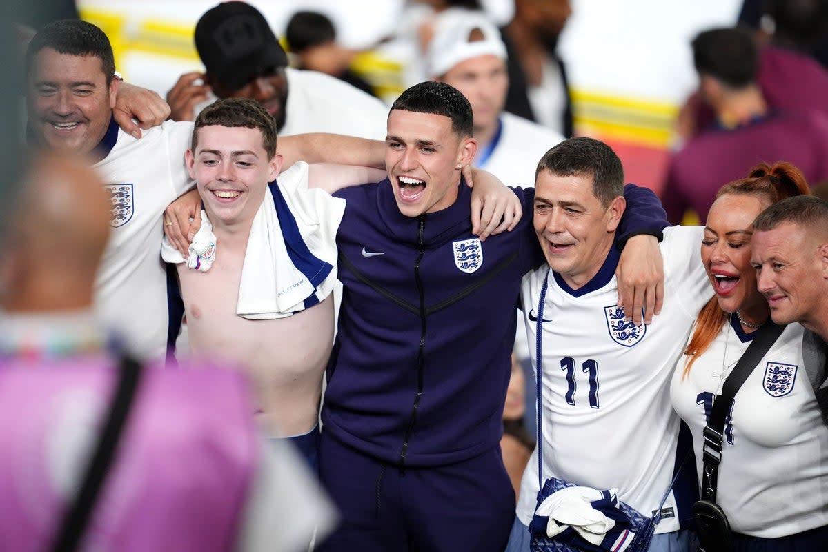 Phil Foden (centre) celebrates with family on Wednesday (Adam Davy/PA Wire)
