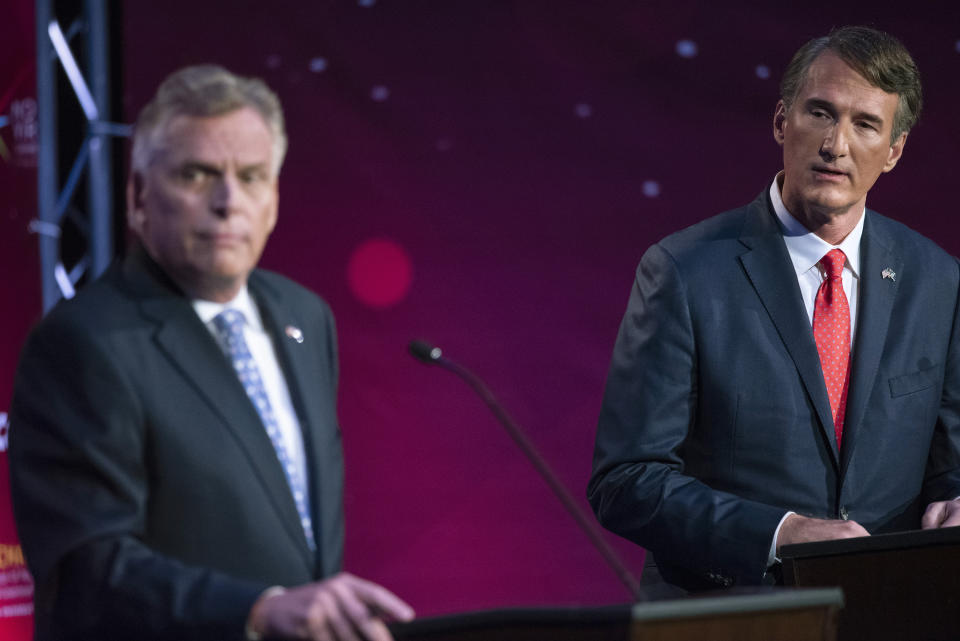 Virginia Democratic gubernatorial candidate and former Gov. Terry McAuliffe, left, and Republican challenger, Glenn Youngkin, participate in a debate at Northern Virginia Community College, in Alexandria, Va., Tuesday, Sept. 28, 2021. (AP Photo/Cliff Owen)