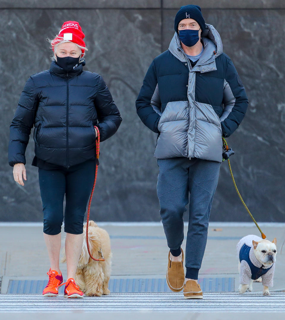 <p>Hugh Jackman and his wife Deborra-Lee Furness take their dogs for a walk by the Hudson River in N.Y.C. on Tuesday.</p>