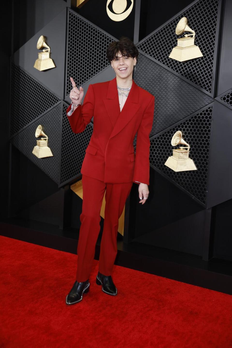Landon Barker wears a red suit