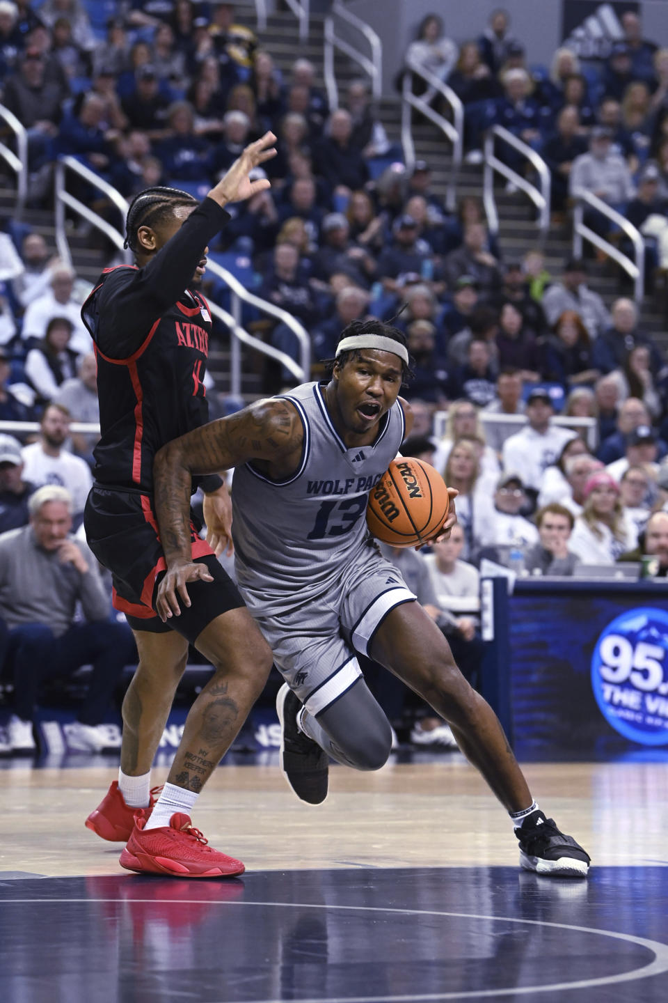 Nevada's Kenan Blackshear drives against San Diego State's Reese Waters during the second half of an NCAA college basketball game Friday, Feb. 9, 2024, in Reno, Nev. (AP Photo/Andy Barron)