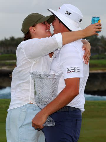 <p>Kevin C. Cox/Getty </p> Joel Dahmen and Lona Dahmen after the the final round of the Corales Puntacana Resort & Club Championship on March 28, 2021.