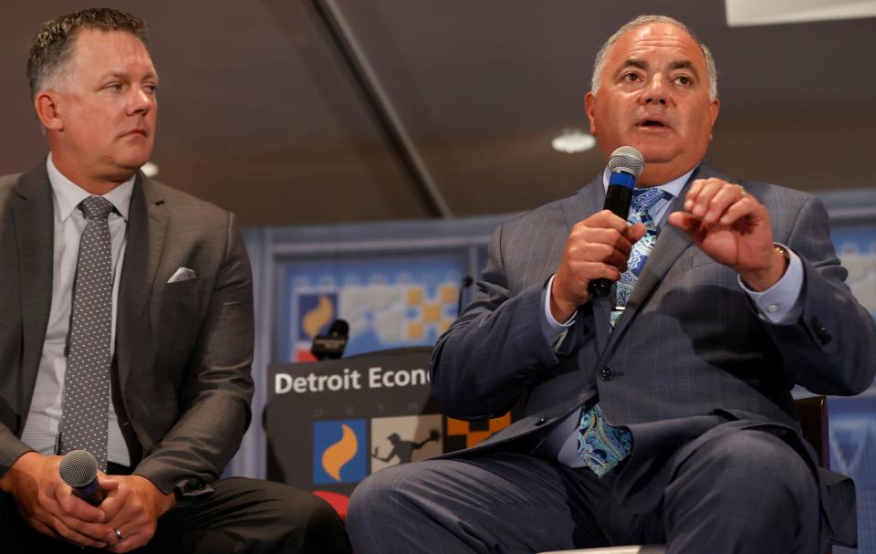 Detroit Tigers manager A.J. Hinch, left, looks on as general manager Al Avila answers a question during a Detroit Economic Club luncheon in a ballroom at the Motor City Casino Hotel in Detroit on Wednesday, May 11, 2022.