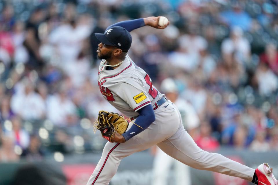 Braves pitcher Darius Vines fires a pitch during his major league debut against the Rockies in Denver on Wednesday night. The St. Bonaventure High graduate allowed just two runs and four hits in six innings to earn his big league win.