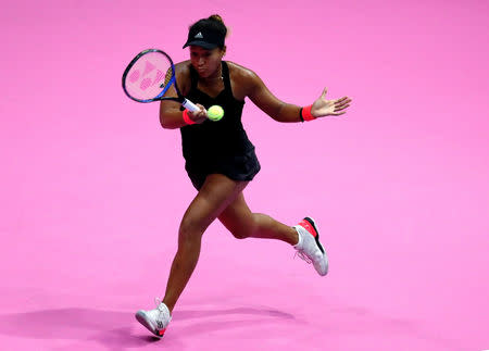 Tennis - Pan Pacific Open Women's Singles Semifinal match - Arena Tachikawa Tachihi, Tokyo, Japan - September 22, 2018. Naomi Osaka of Japan returns a ball to Camila Giorgi of Italy. REUTERS/Toru Hanai