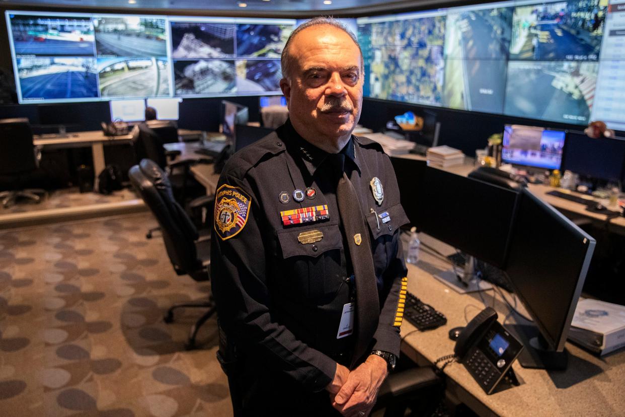 Memphis Police Department Deputy Chief Joe Oakley, who oversees the department's information systems, poses for a portrait in front of a wall of screens showing live camera feeds from around the city at the Memphis Police Department’s real time crime center on Wednesday, February 14, 2024.