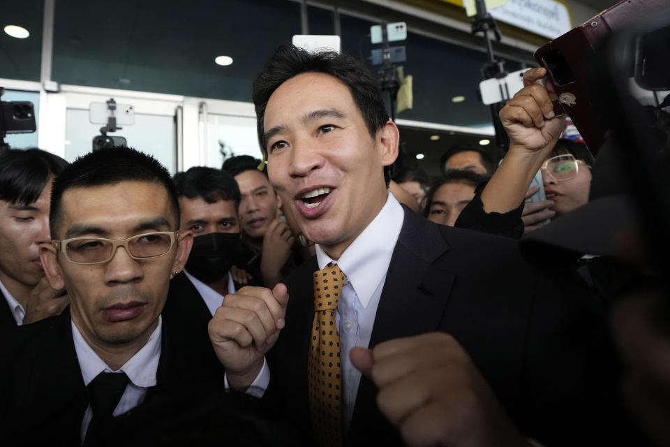 Former leader of Move Forward Party Pita Limjaroenrat, center, leaves Constitutional Court in Bangkok, Thailand, Wednesday, Jan. 24, 2024. The court ruled Wednesday that popular politician Pita, who was blocked from becoming prime minister even though his party placed first in last year’s election, did not violate the election law and can retain his seat in Parliament. (AP Photo/Sakchai Lalit)