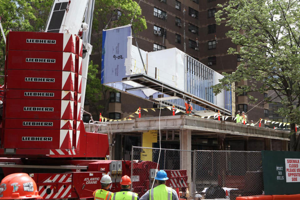 One by one, the pre-fab units are assembled at Carmel Place. (Photo: Monadnock Development)