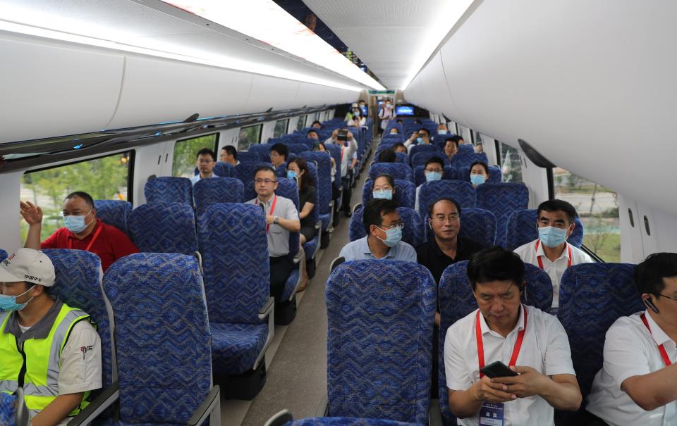 people sit on train