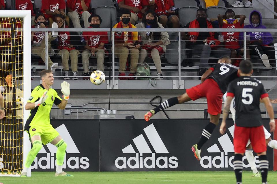 D.C. United's Ola Kamara (9) scores on a header past Chicago Fire FC goalkeeper Bobby Shuttleworth in the first half at Audi Field. Kamara scored all three goals in D.C. United's 3-0 win.