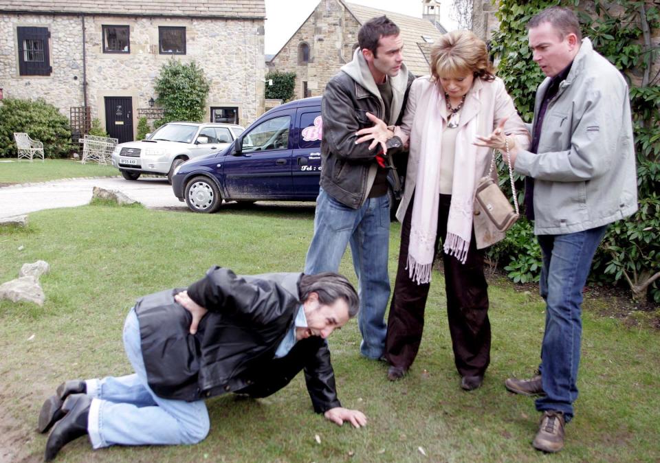 Dale Meeks as Simon in Emmerdale, with, l-r, Brian Hibbard, Daniel Brocklebank and Sherrie Hewson, who played Simon's mother - ITV/Shutterstock