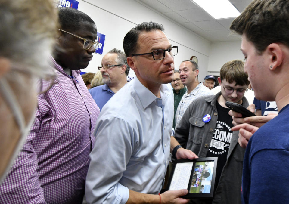Josh Shapiro, Pennsylvania's Democratic nominee for governor, greets people in the crowd after he spoke at a campaign event at Franklin County Democratic Party headquarters, Sept. 17, 2022, in Chambersburg, Pa. (AP Photo/Marc Levy)