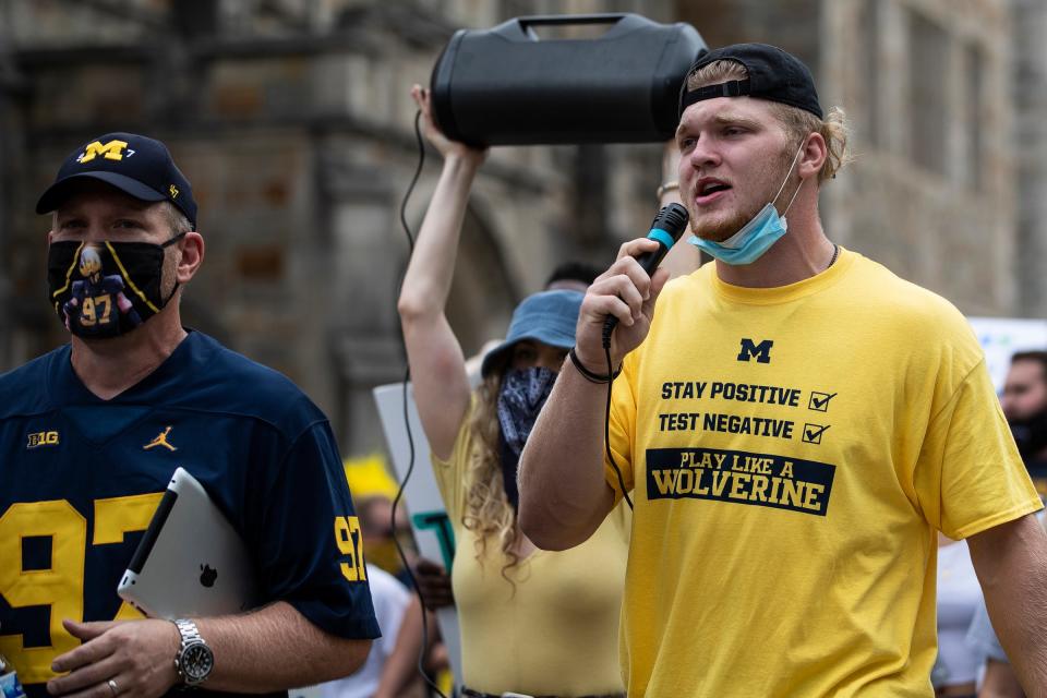 Michigan defensive lineman Aidan Hutchinson speaks as they march on South State Street on U-M campus in Ann Arbor to protest the postponement of the fall football season, Saturday, Sept. 5, 2020.