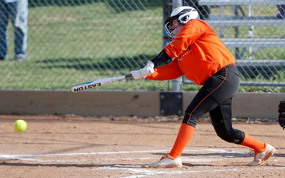 Ashland High School's Marcy Baker (18) connects with a pitch against Mansfield Senior High School during high school softball action Wednesday, April 27, 2022 at Ashland High School. TOM E. PUSKAR/TIMES-GAZETTE.COM