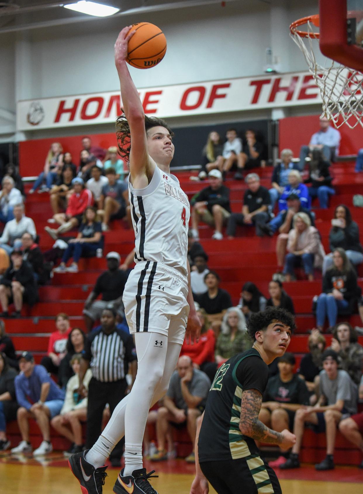 Loghan Downie (4), of South Fork High School, drives to the basket above Joey Falcon, of Viera, for another 2 points in the third period of their District 8-6A championship game at South Fork High School on Saturday, Feb. 10, 2024, in Tropical Farms. South Fork wins 53-36.