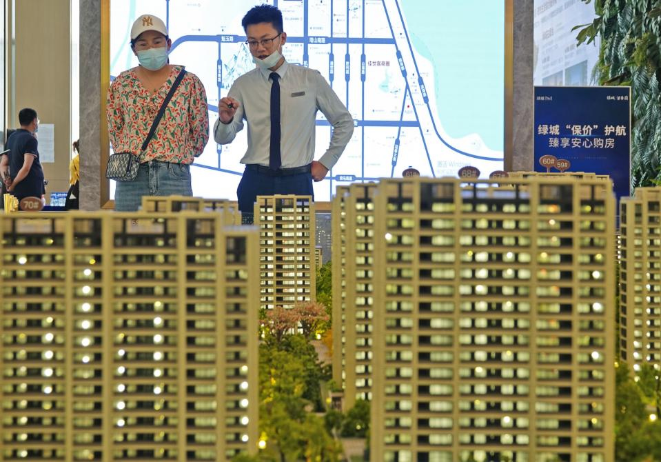 YANTAI, CHINA - JUNE 12, 2022 - Citizens view sand tables at a real estate exhibition hall in Yantai, East China's Shandong Province, June 12, 2022. According to securities Times news, as of June 9, 16 provinces (autonomous regions, municipalities) issued a package of implementation plans to stabilize the economy specifically mentioned the real estate policy. In just nine days in June, 41 places introduced policies to stabilize the property market. (Photo credit should read CFOTO/Future Publishing via Getty Images)