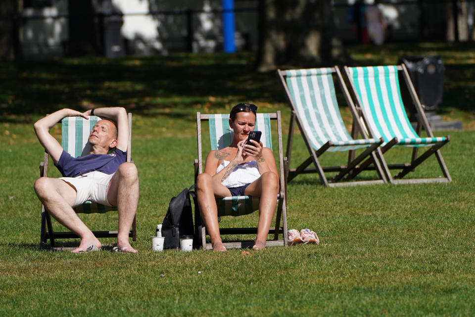 <p>People enjoy the hot weather in St James's Park in central London. Picture date: Wednesday September 8, 2021.</p>
