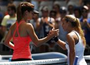 Dominika Cibulkova (R) of Slovakia shakes hands with Tsvetana Pironkova of Bulgaria after winning their women's singles second round match at the Australian Open 2015 tennis tournament in Melbourne January 22, 2015. REUTERS/Thomas Peter (AUSTRALIA - Tags: SPORT TENNIS)