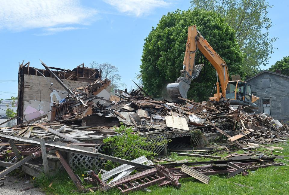 In this file photo, a demolition crew from Kingsview Enterprises in Lakewood, New York, used an excavator to tear down this vacant house on a blighted property at 1708 Sassafras St. in Erie on May 21, 2018.