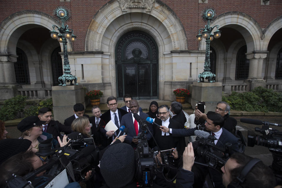 Gambia's Justice Minister Aboubacarr Tambadou comments outside the International Court in The Hague, Netherlands, Thursday, Jan. 23, 2020, after the court ordered Myanmar take all measures in its power to prevent genocide against the Rohingya. The United Nations' top court issued a decision on a request by Gambia. (AP Photo/Peter Dejong)