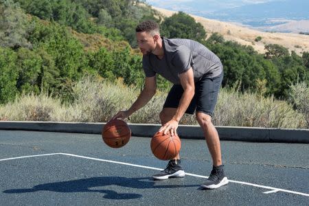 Golden State Warriors NBA basketball player Stephen Curry is filmed for an Infiniti car advertisement in Blackhawk, California, U.S. June 26, 2017. REUTERS/Kate Munsch