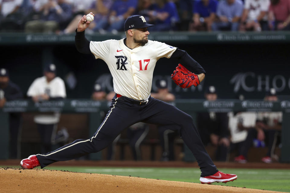 Texas Rangers pitcher Nathan Eovaldi (17) delivers against the Cincinnati Reds during the first inning of a baseball game Friday, April 26, 2024, in Arlington, Texas. (AP Photo/Richard W. Rodriguez)