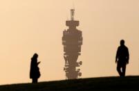 FILE PHOTO: The BT communication tower is seen in the background as people walk on Primrose Hill in London