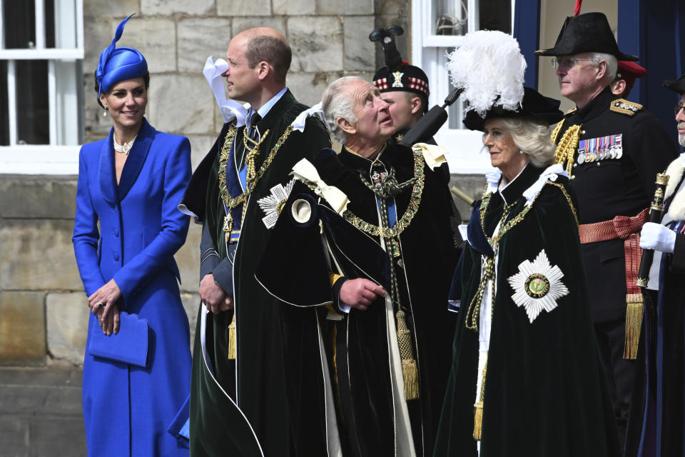 Britain's Prince William and Kate, Princess of Wales, known as the Duke and Duchess of Rothesay while in Scotland, and King Charles III, Queen Camilla, view the fly past by the Red Arrows outside the Palace of Holyroodhouse for the National Service of Thanksgiving and Dedication for King Charles III and Queen Camilla, and the presentation of the Honours of Scotland, in Edinburgh, Wednesday, July 5, 2023. (John Linton/Pool photo via AP)