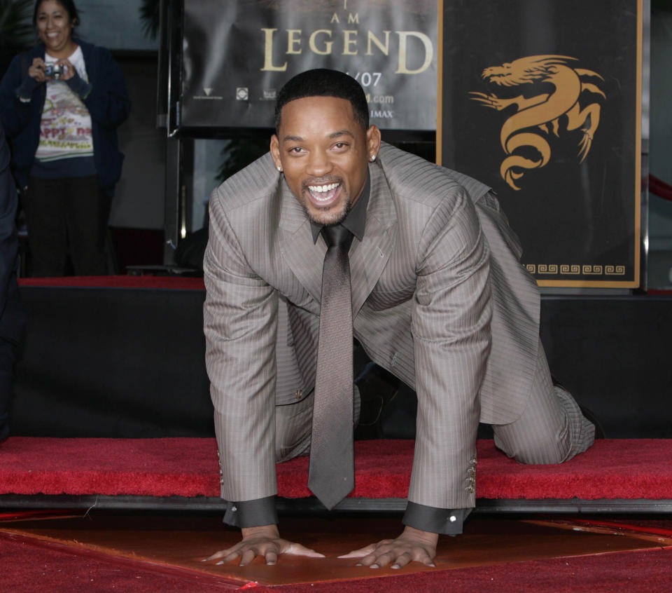 Actor Will Smith, star of "I Am Legend," places his hands in cement during a hand and footprint ceremony at Grauman's Chinese Theater Monday, Dec. 10, 2007, in the Hollywood section of Los Angeles. (AP Photo/Nick Ut)