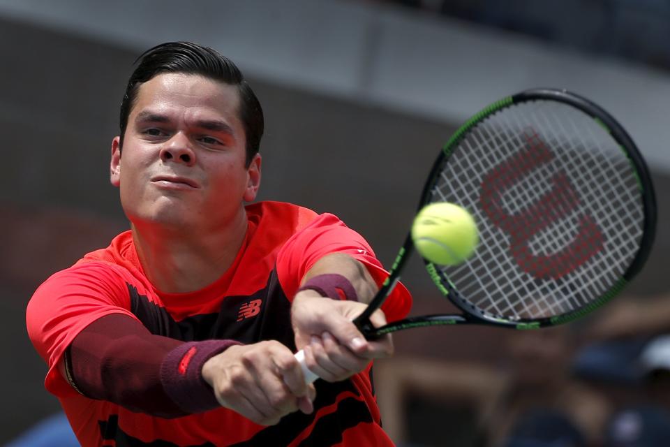 Milos Raonic of Canada hits a return to Fernando Verdasco of Spain during their match at the U.S. Open Championships tennis tournament in New York, September 2, 2015. REUTERS/Mike Segar