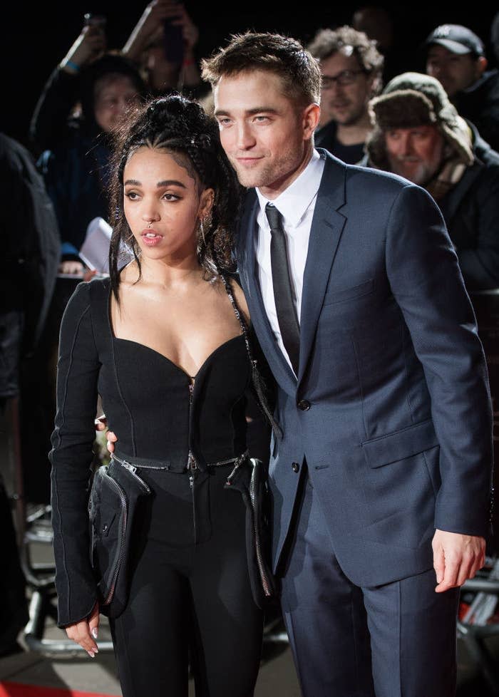 Robert with his arm around FKA Twigs on the red carpet