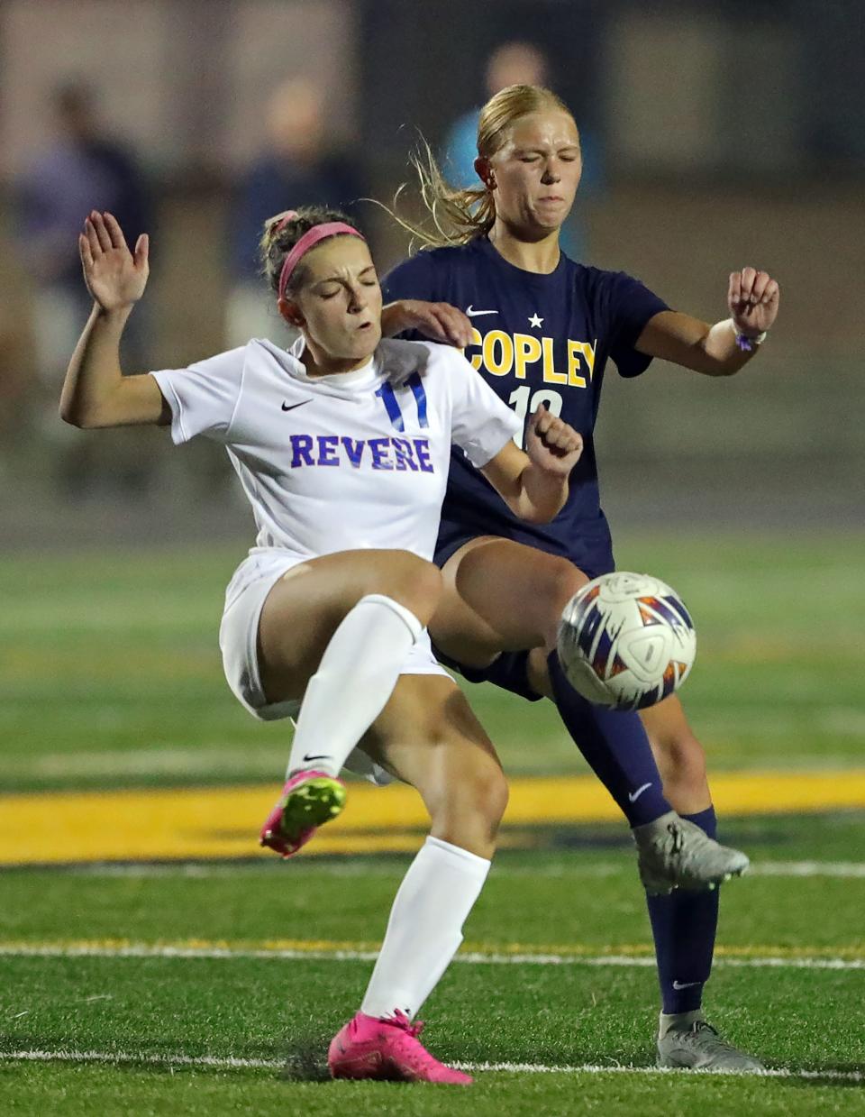 Revere's Lily Hughes, left, and Copley's Emily Kerekes battle for the ball during the second half Wednesday in Copley.