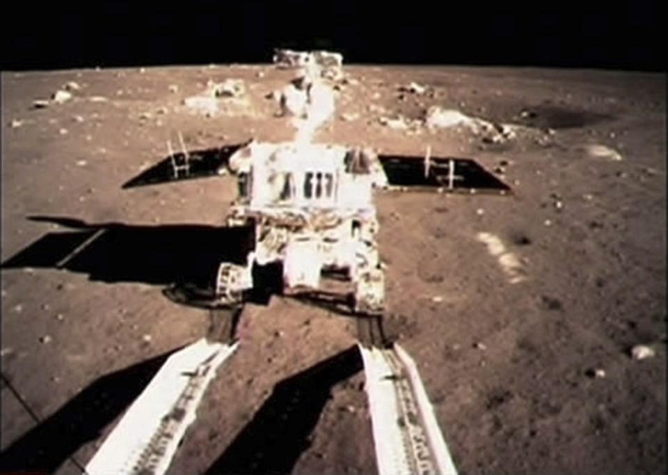 FILE - In this Dec. 15, 2013 photo made by the on-board camera of the lunar probe Chang'e-3 displayed at the Beijing Aerospace Control Center in Beijing, China's first moon rover "Jade Rabbit" touches the lunar surface. (Xinhua via AP, File)