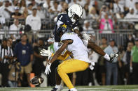 West Virginia cornerback Beanie Bishop Jr., bottom, breaks up a pass intended for Penn State wide receiver KeAndre Lambert-Smith (1) during the first half of an NCAA college football game against Penn State, Saturday, Sept. 2, 2023, in State College, Pa. (AP Photo/Barry Reeger)