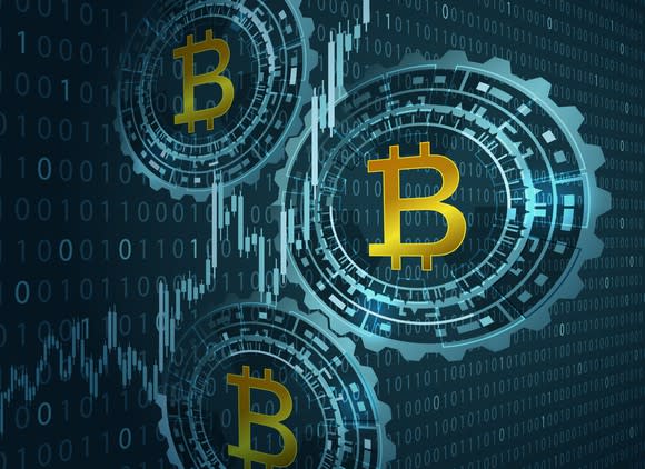 Bitcoin symbols on a binary code background.