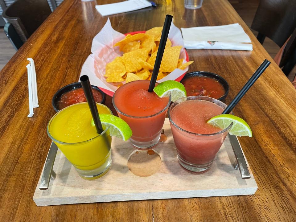 A flight of margaritas and warm chips and fresh salsa at Los Cabos Mexican Restaurant in Akron.